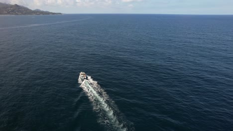 drone shot folowing fishing boat at sea mahe seychelles