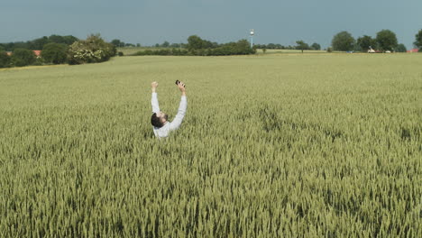 sad and angry businessman in middle of fields, concept of lost person with depression