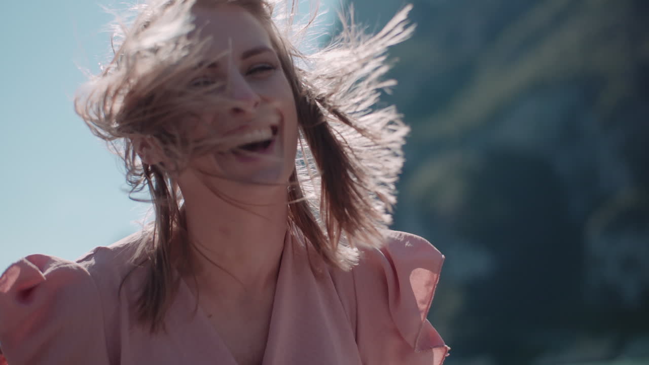 Happy Woman Adjusting Glasses and Smiling at Camera