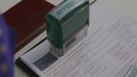 Pressing Approval Stamp on European Union Visa Application Form