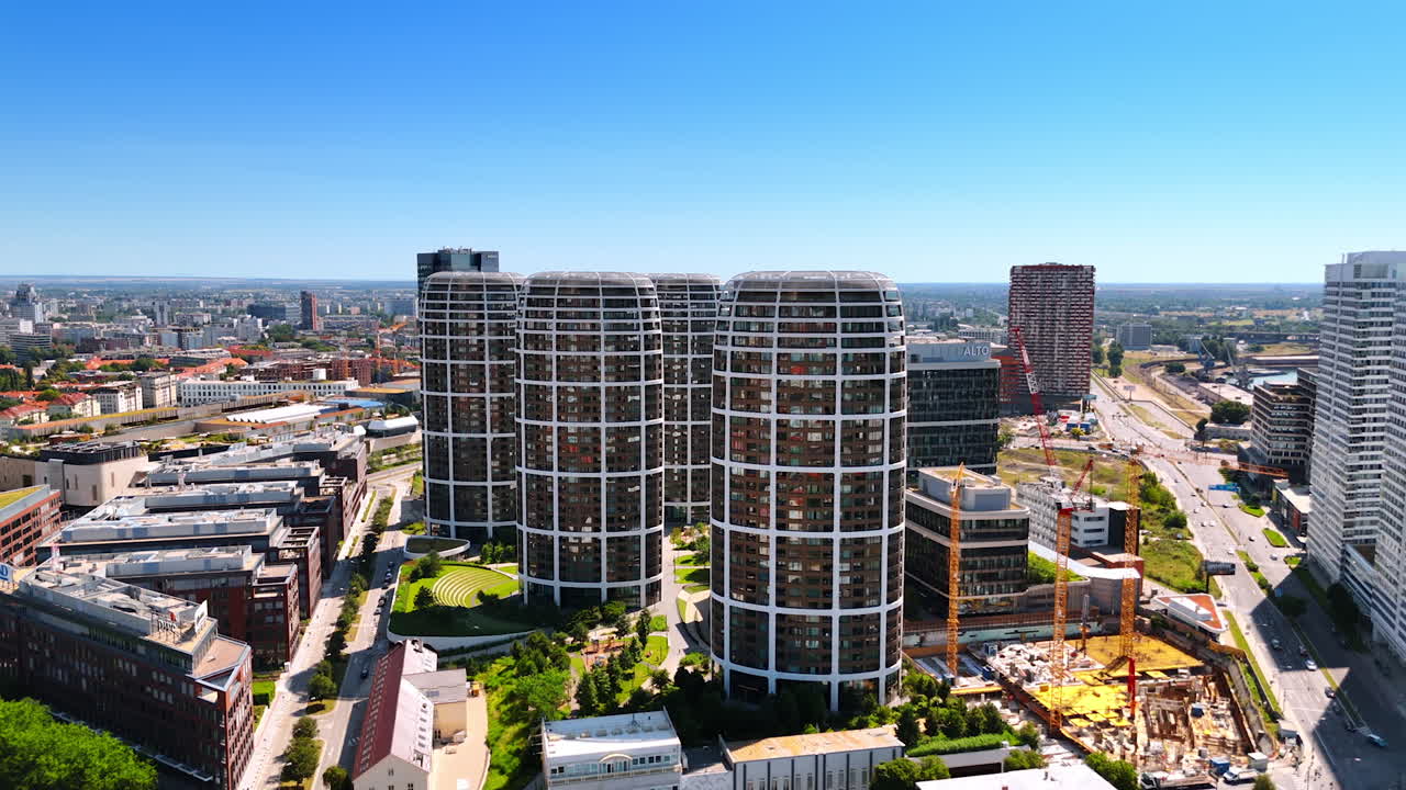 Approaching a group of similar high-rises in the new urban neighborhood. Modern architecture of Bratislava, Slovakia. Aerial view