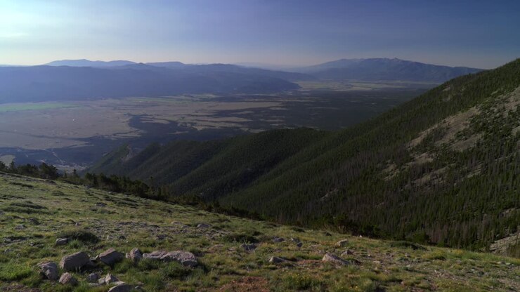 Mt Mount Princeton Colorado trail Chalk Cliffs Salida landscape valley view summit hiking 14er spring summer Sawatch Range Rocky Mountains blue sky morning haze pan left motion