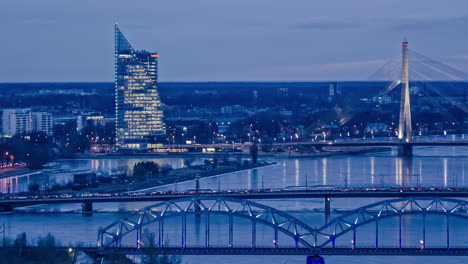 riga skyscraper and bridges with traffic and night with glowing lights, fusion time lapse