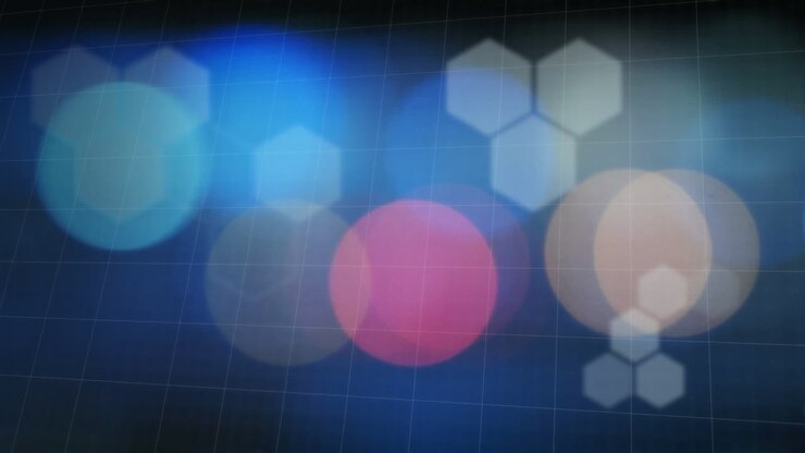 Animation of flickering hexagons and spots of light over blue grid