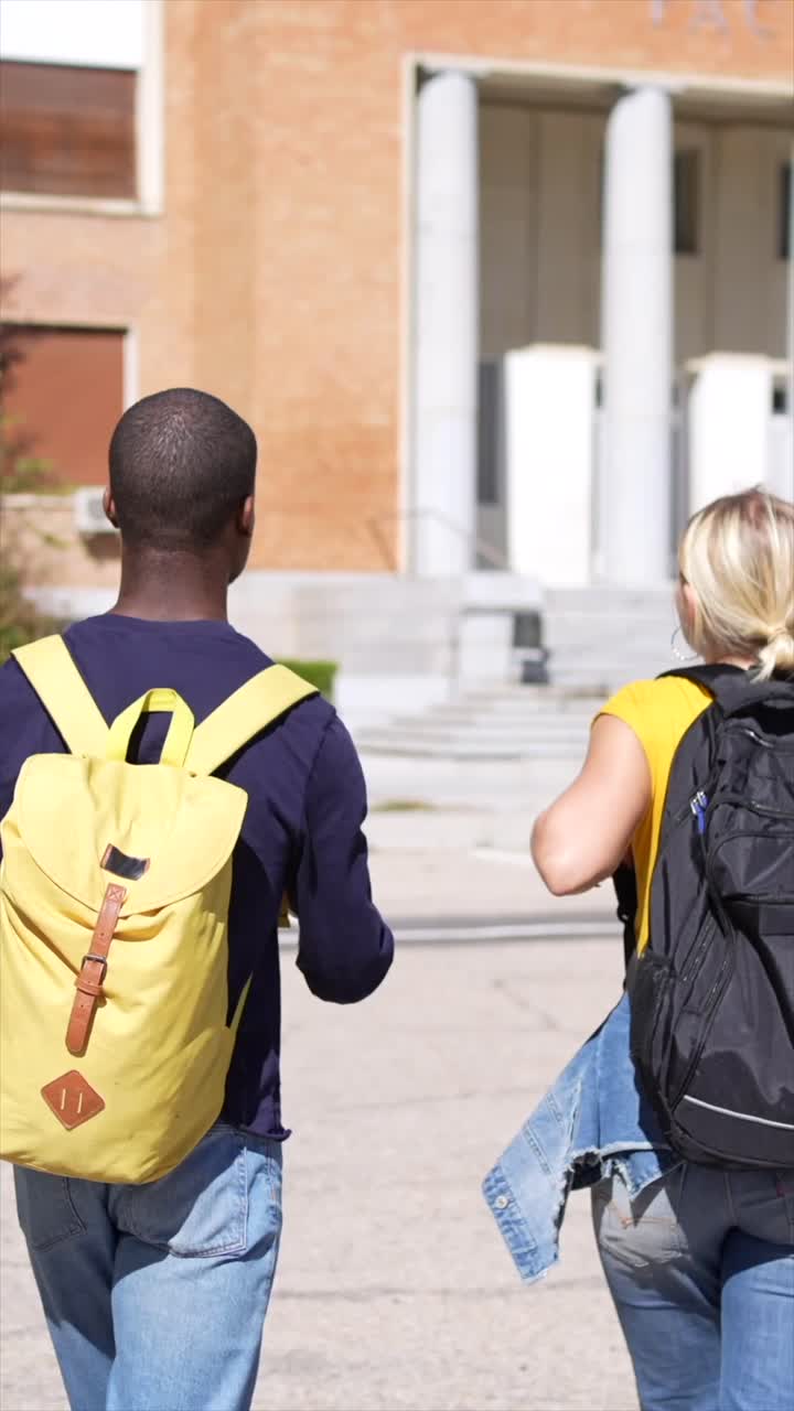 Students with backpacks at a university building