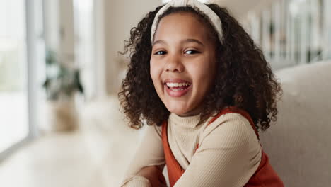 portrait of a smiling girl with curly hair