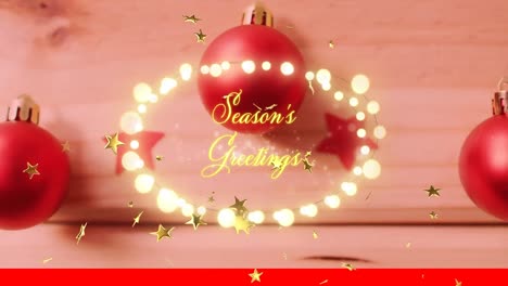 Animation-of-seasons-greetings-text-over-christmas-baubles