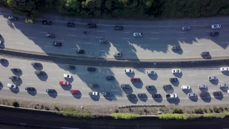 highway top down view of cars going in opposite direction slowly in a traffic jam on a evening in san francisco hold shot