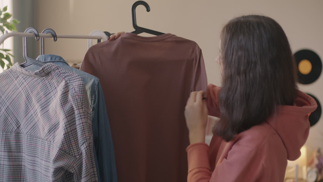 Teenage Girl Choosing Clothes