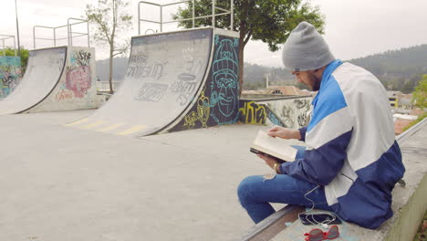 Young-boy-reading-a-book-on-the-street