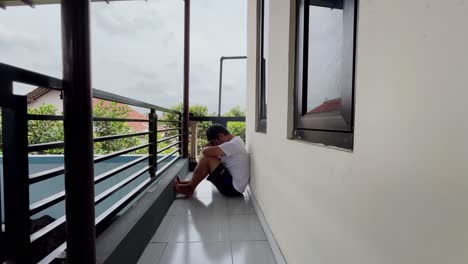 an anxious depressed man in despair sitting on the floor