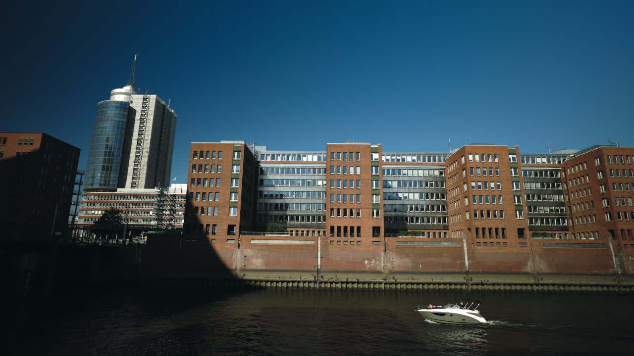 Cityscape with buildings and a boat on the water