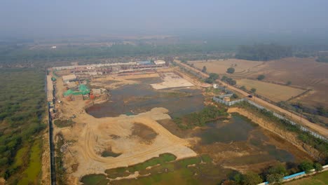 aerial drone shot capturing a massive construction site in noida india