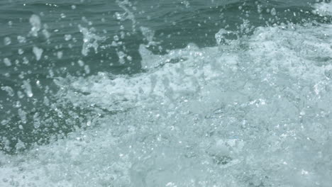 close up of sea water waves from motor boat