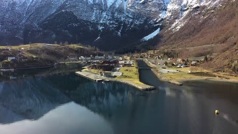 Flam-village-aerial-overview---Ascending-aerial-with-tilt-down-during-sunny-spring-morning