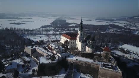 flying around nitra castle front side in winter, aerial shot, slovakia