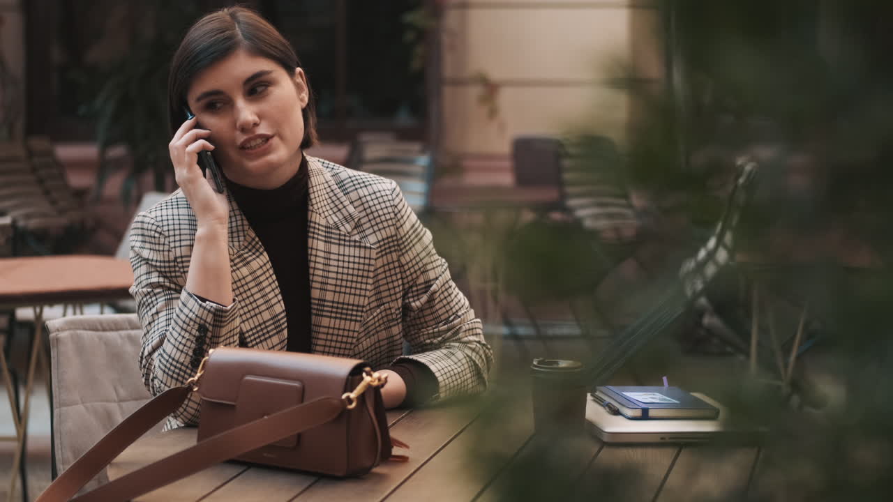 Businesswoman in a coffee break outdoor.