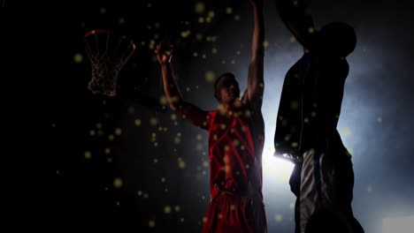 animation of light spots over biracial male basketball players playing