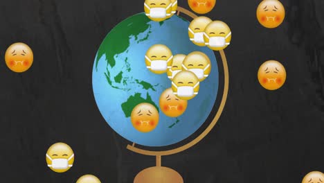 Multiple-face-emojis-moving-over-spinning-globe-against-black-background