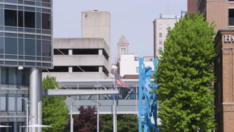 telephoto shot of overlapping buildings in a downtown environment with small flag flying