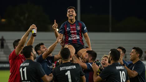 celebrating victory: a team lifts their star player in joyous triumph after a successful match, showcasing the spirit of sportsmanship and collaboration