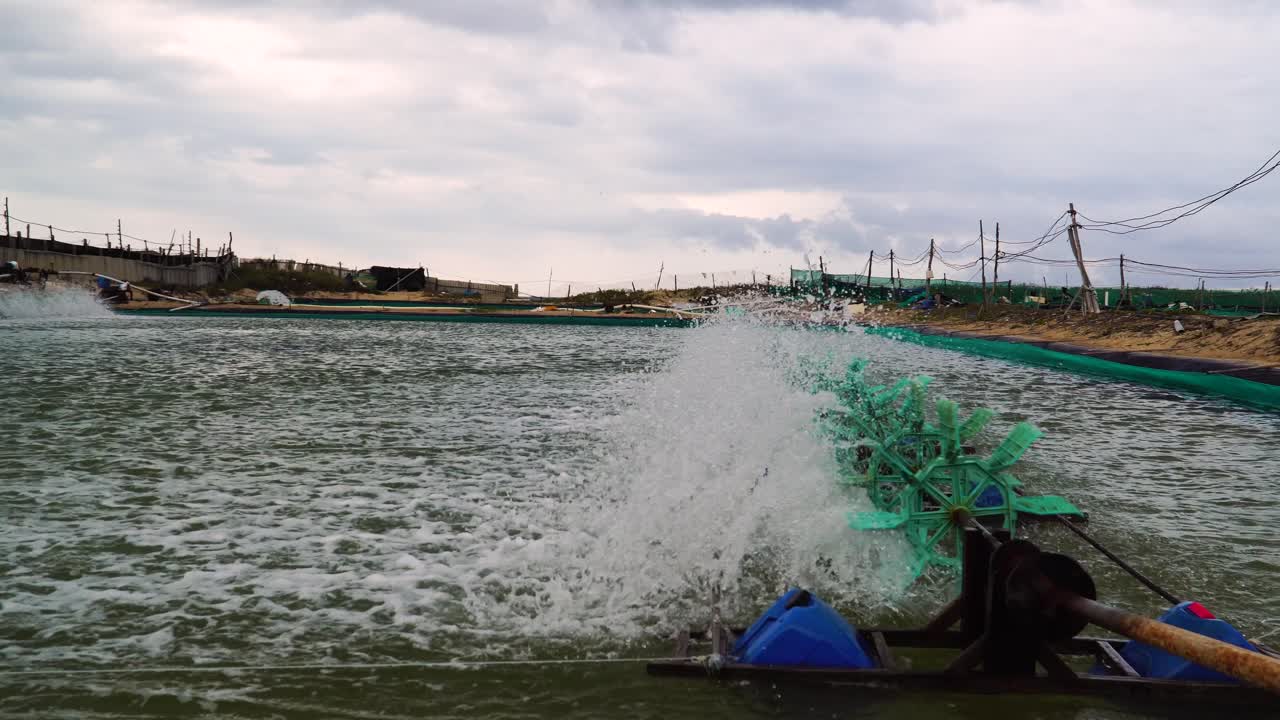 Shrimp Farming Aerators Running In Pond In Son Hai, Vietnam. Pan Left