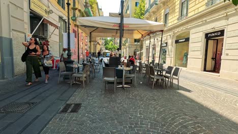 outdoor cafe with people and street activity