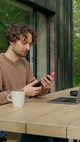 man working from home on a patio