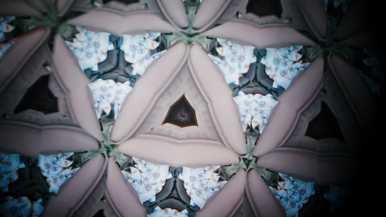 A creative kaleidoscope effect featuring multiple mirrored images of sleeping babies wrapped in blankets