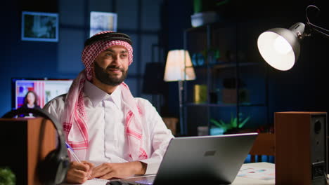 employee working from home writing