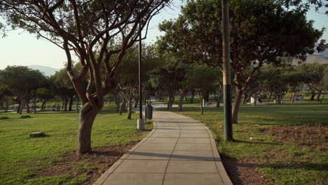 Stabilized-walking-shot-through-a-public-park-in-El-Sol-de-la-Molina,-Lima,-Peru