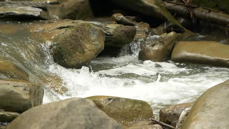 slow motion of casoca river flowing and raging among rocks, full hd