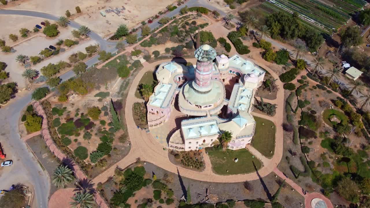 Neot Smadar Arts Center building and street view from above surrounded by garden in Arava desert, Drone view