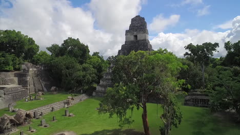 great aerial shot over the tikal pyramids in guatemala 12