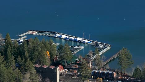 drone shot of the the marina in tahoe city on lake tahoe with boats