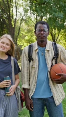 students relaxing in park