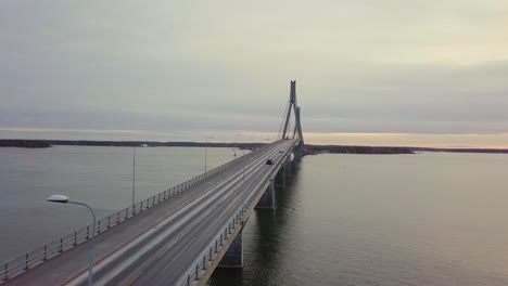 aerial directly above traffic on two lane road on replot bridge in finland