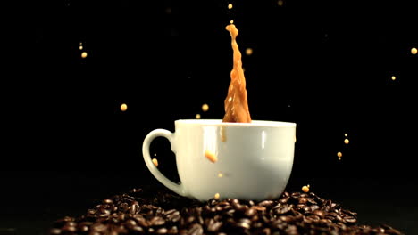sugar cube falling in coffee cup and splashing