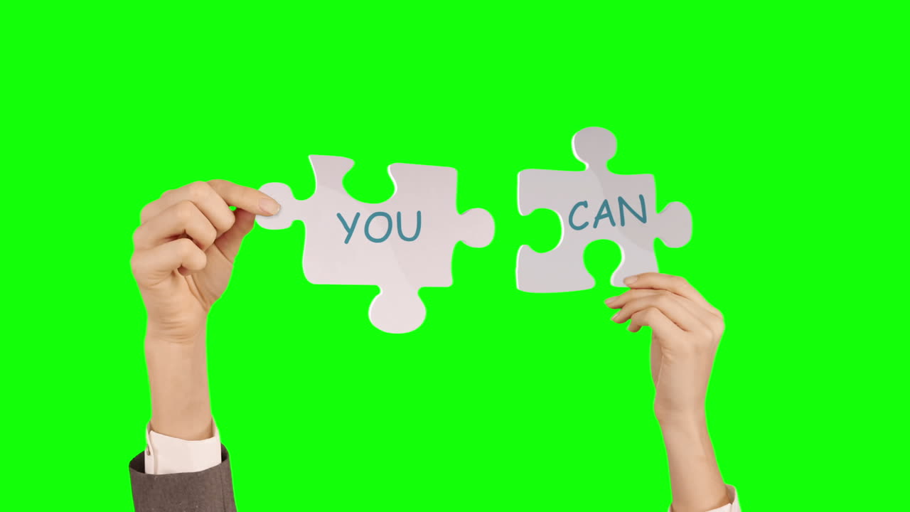 Hands holding puzzle pieces