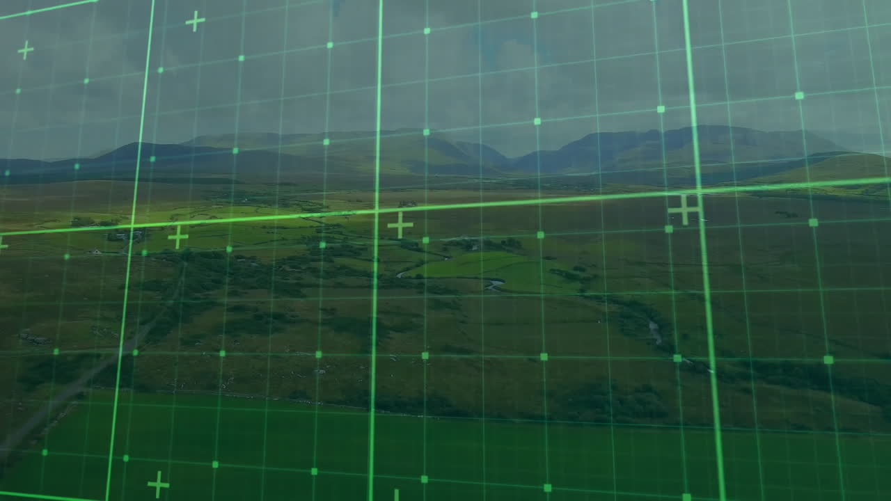 Green grid overlay animation over aerial view of expansive landscape