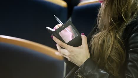 woman using digital tablet. close up of a woman using digital tablet on a business meeting