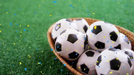 Animation-of-confetti-falling-over-soccer-balls