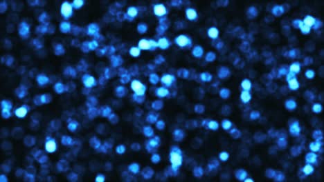 hermoso bucle de luces bokeh azules brillantes animación para el fondo. bucle sin problemas 4k movimiento de textura abstracta.