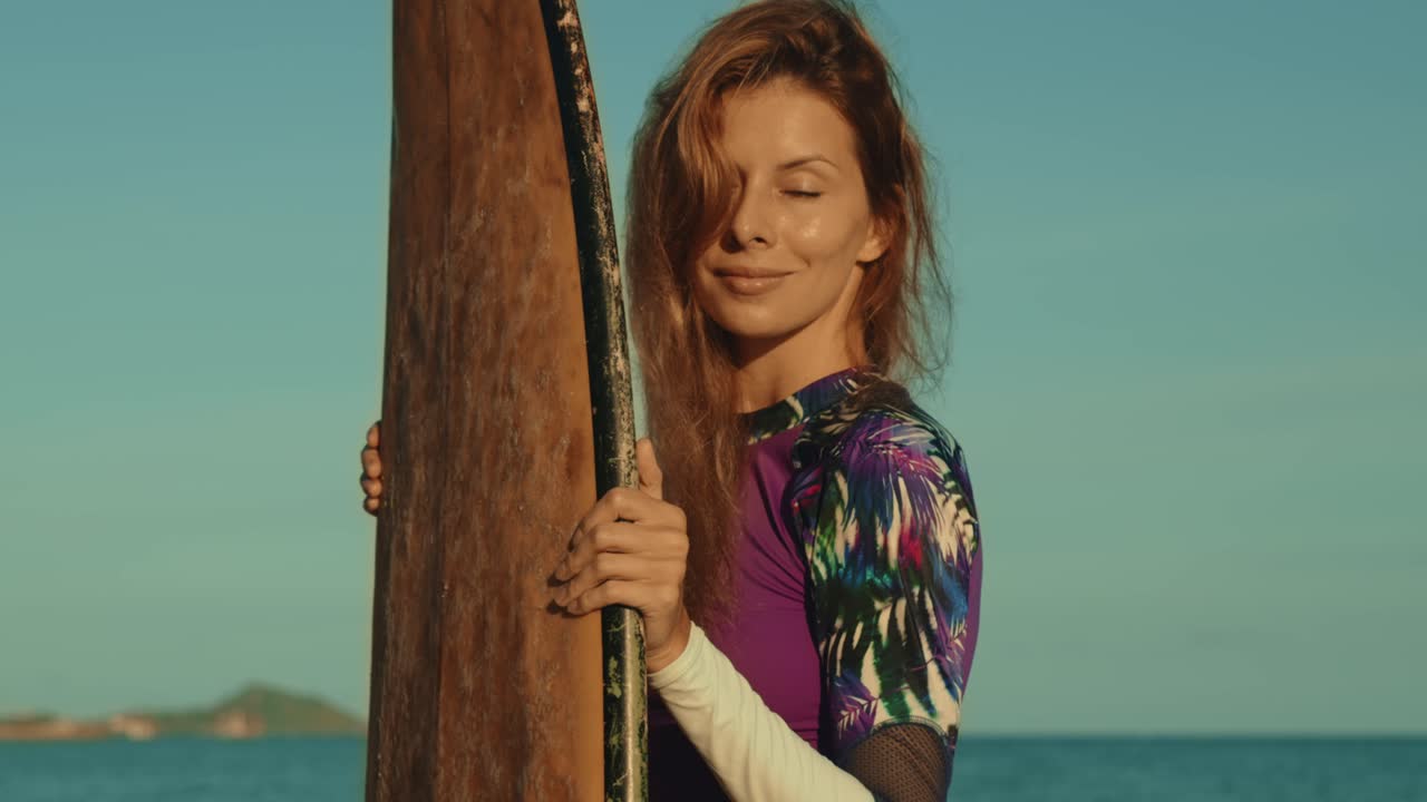 Woman with Surfboard at the Beach