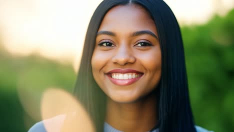 beautiful woman with long black hair smiling