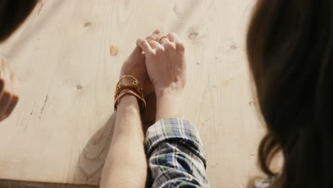 young romantic caucasian couple excited nervous holding hands