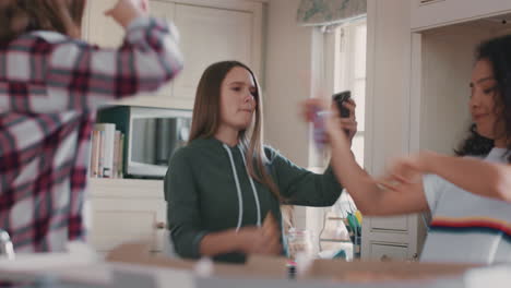 happy-teenage-girls-dancing-in-kitchen-eating-pizza-having-fun-celebrating-together-enjoying-hanging-out-on-weekend