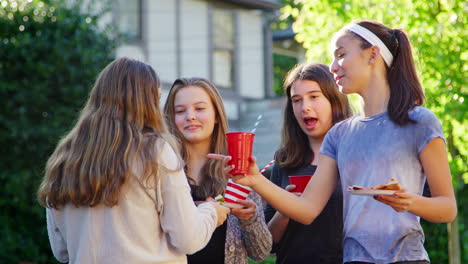 teen girl friends chatting at neighbourhood block party