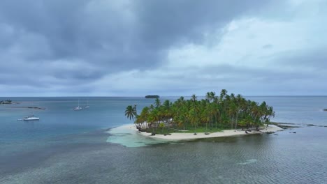 drone around one of the san blas islands in panama. wide shot circling right to left drone