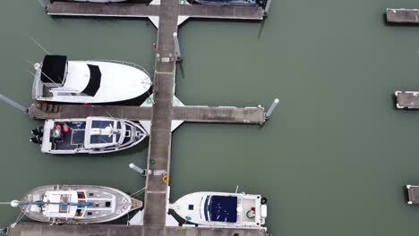 aerial top down view of boats in marina